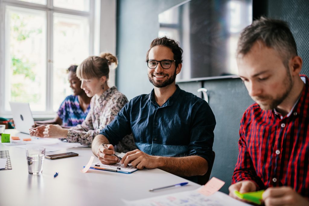 Diverse millennial business people working on crowdfunded project proposal
